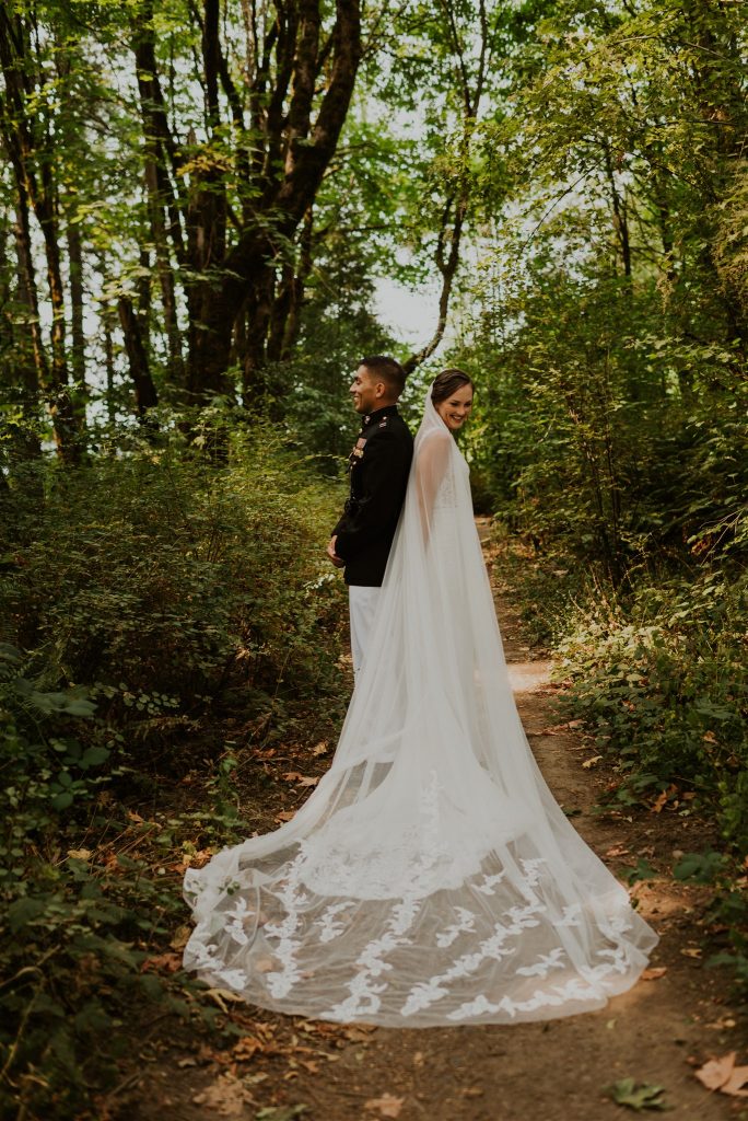 Bride and groom first look wedding portraits in secluded forest in Portland, Oregon